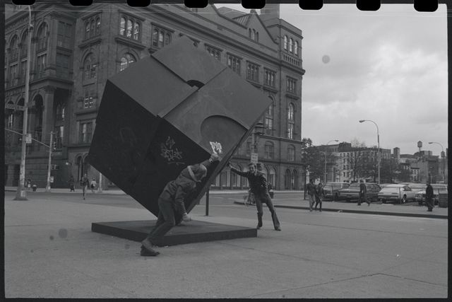 people pushing the astor place cube in 1969
